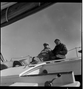 Image of MacMillan and Miriam sit on Bowdoin's tilted deck
