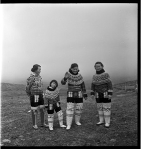 Image: Three Inuit women and a girl in traditional dress, front view