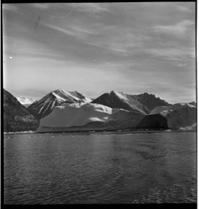 Image of Large iceberg against shore