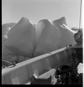Image: The BOWDOIN tied to a wave-washed iceberg