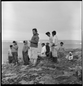 Image of Group of Polar Eskimo [Inughuit] men and boys near shore
