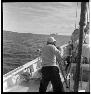Image: Jack photographing iceberg from deck