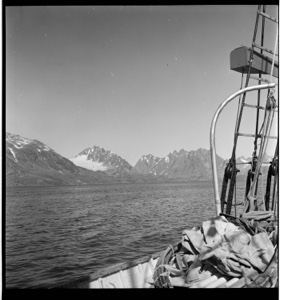 Image of Greenland's mountains through rigging