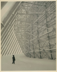 Image of Man looking up at radar sphere superstructure