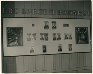 Image of Bulletin board with pictures of 14 men