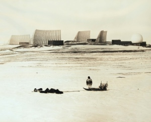 Image of View of BMEWS with Inughuit man and sledge in foreground