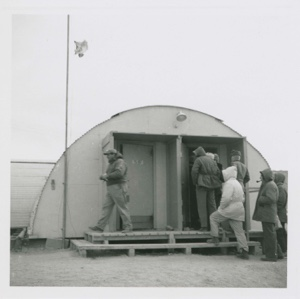 Image of Men entering building, Thule AFB