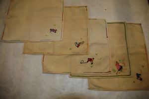 Image of Set of 5 embroidered napkins, each with single figure 