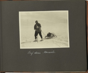 Image: Auf dem Marsche [On the march: man on snowshoes pulling small loaded sledge]