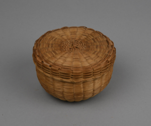 Image: small green ash and grass basket