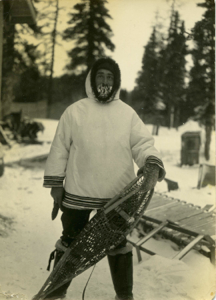 Image of Man (A.G. Ruechert?) Posing with Snowshoes