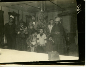 Image of Innu Family Standing around Christmas Tree