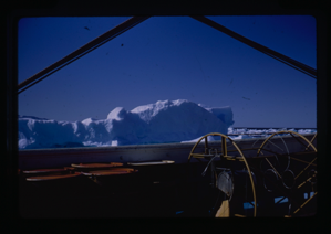 Image of Iceberg near ship.