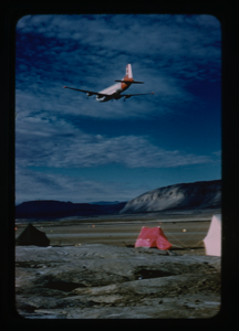 Image of Plane flying over camp