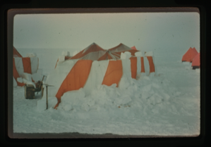 Image: Orange and white striped tent.