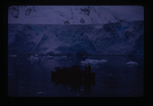Image: People on boat near glacier