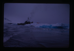 Image of Naval ship "GB5" and helicopter near ice floe