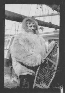 Image: man on deck in furs, with snowshoes 