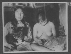Image: Engingwah holding dog, with Eskimo woman sewing