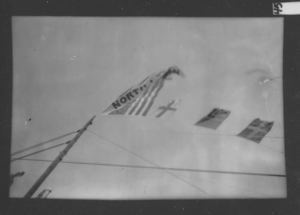 Image of Flags on mast of Roosevelt, including North Pole Flag