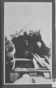 Image of Borup and Bartlett shooting from a whaleboat