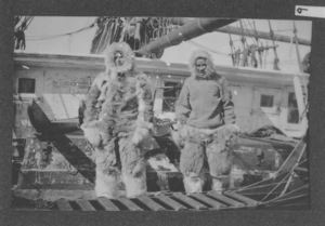 Image: MacMillan and George Borup on deck in furs, with sledge
