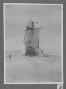 Image of The Roosevelt iced in, with sails drying, at Cape Sheridan