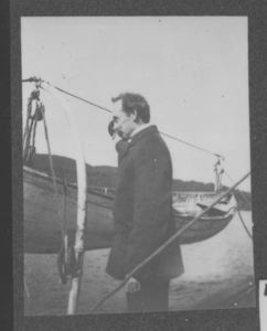 Image of Peary on deck by whale boat