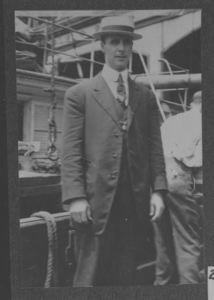Image of MacMillan in dress suit, on deck