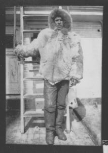 Image of MacMillan in fur parka- on deck