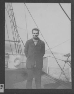 Image: Borup standing on deck, in a cloth coat