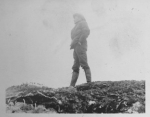 Image of [Man standing on high ground]