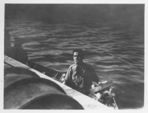 Image of [Man in small boat along side Bowdoin]