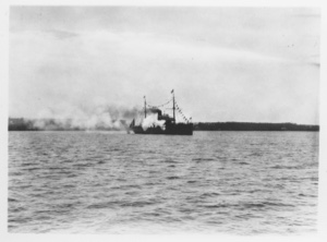 Image of [Ship with flags, billowing smoke]