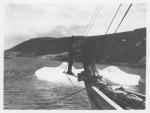Image of [Two men on bow of Bowdoin, near ice floe]
