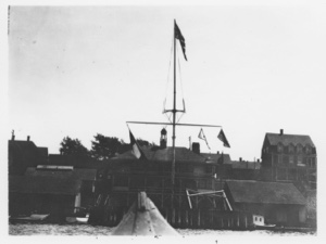 Image of [Buildings behind  flagpole. Note Chicago Yacht Club pennant]