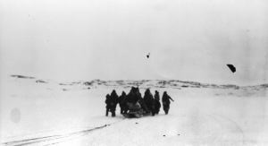 Image of Eskimo [Inuit] group about sledge
