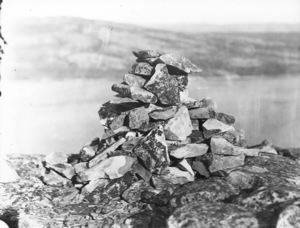 Image: Cairn in which MacMillan left record (N.B. L191, same image, says 1931 ), 