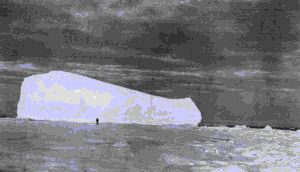 Image of Iceberg in the Polar Pack; man in foreground -Smith Sound