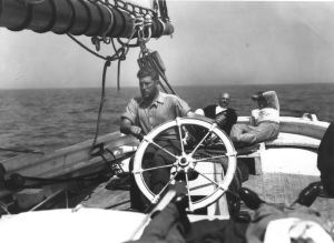 Image of Aboard the Thebaud, Russell Welsh at wheel