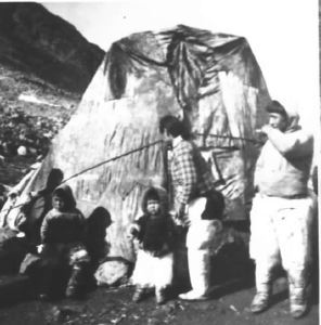 Image of Eskimo [Inuit] family outside tupik