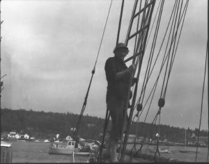 Image of Miriam MacMillan in rigging aboard the Schooner Bowdoin