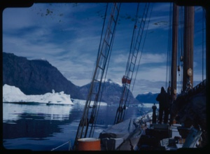 Image of Icebergs through rigging. Crewman on deck