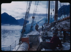 Image of Iceberg ahead, through rigging, Crew on deck