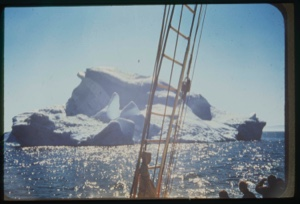 Image of Iceberg through rigging with sun reflection
