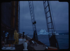 Image of Iceberg through rigging, grey sky