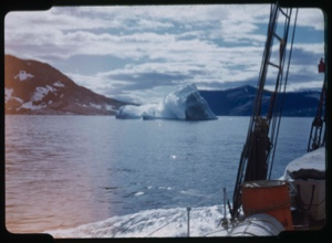 Image: Iceberg and clouds through rigging