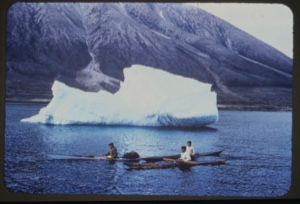 Image of Three kayakers near iceberg