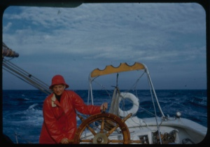 Image of Miriam MacMillan in red slicker at wheel