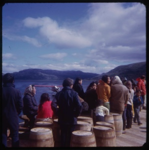 Image of Eskimo [Inuit] group on dock, near seaplane